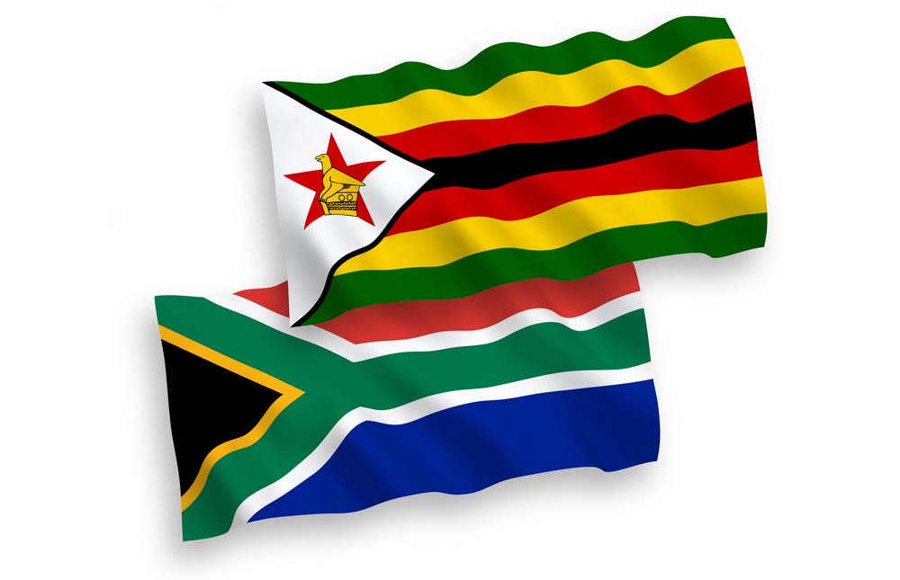 National vector fabric wave flags of Zimbabwe and Republic of South Africa isolated on white background. 1 to 2 proportion.